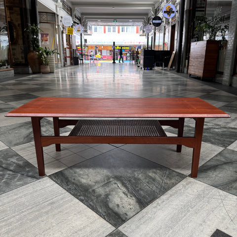 Danish style teak coffee table with rattan shelf